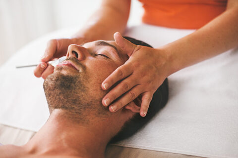 man getting facial treatment